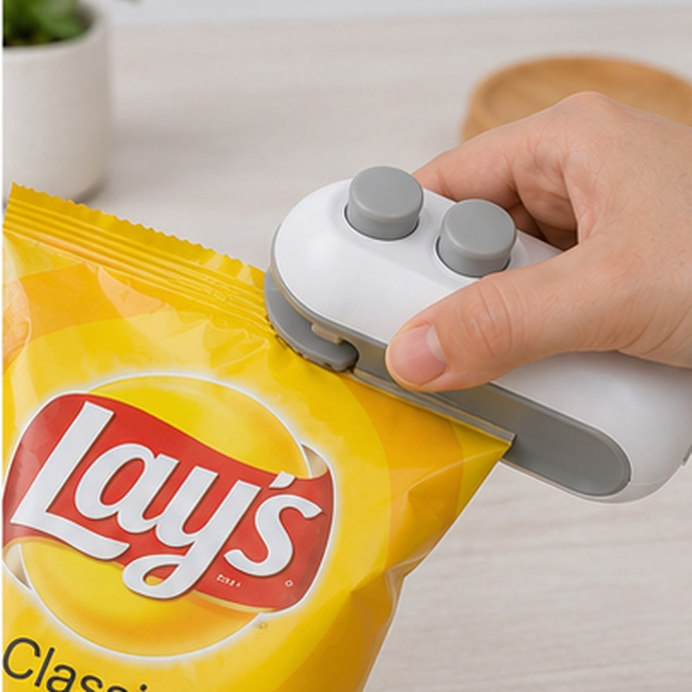 Portable mini heat sealing machine for food packets